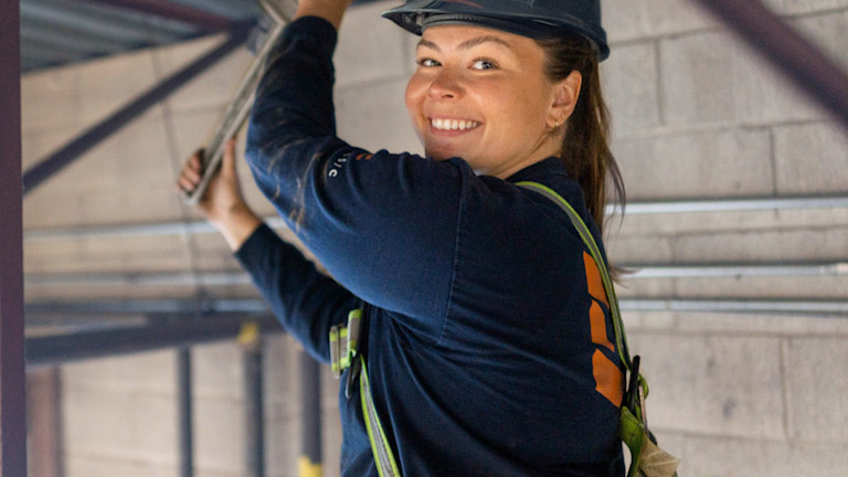 A woman contractor smiling