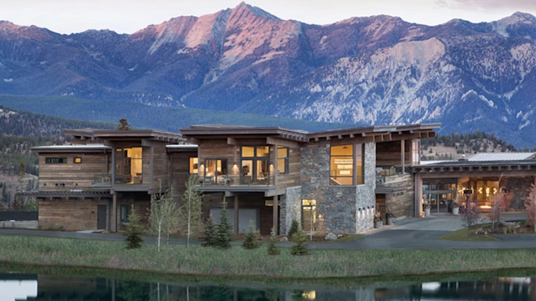 A luxurious wood cabin by a lake
