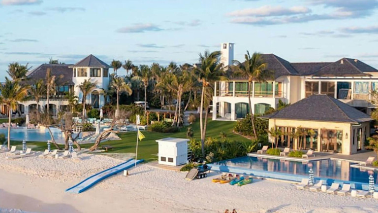 A luxurious beachfront mansion with direct access to a beach