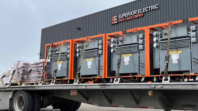 A truck carrying a Superior Electric Great Lakes Company container