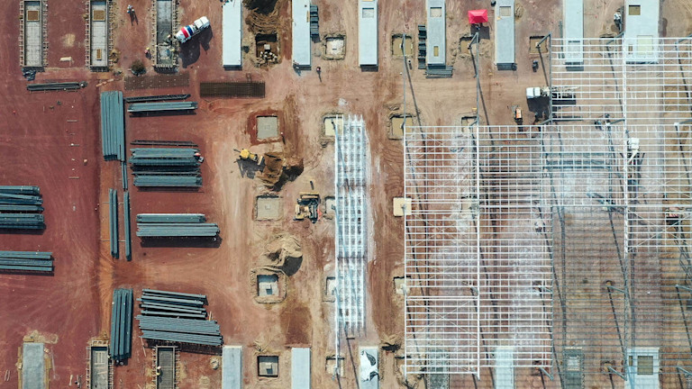 A construction site with a metal frames and beams